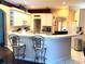 Eat-in kitchen featuring bar stool seating and white cabinets at 433 Woodcrest St, Winter Springs, FL 32708
