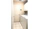 Efficient laundry room with white cabinetry, tile flooring, and modern washer and dryer units at 433 Woodcrest St, Winter Springs, FL 32708