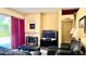 Cozy living room with a fireplace, neutral decor, and sliding glass doors to the pool area at 433 Woodcrest St, Winter Springs, FL 32708