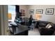 Home office with a large desk, leather chair, and lots of decorative pictures on the wall at 433 Woodcrest St, Winter Springs, FL 32708