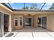 Outdoor patio with ceiling fan offers seamless transition between indoor and outdoor living spaces with pool views at 433 Woodcrest St, Winter Springs, FL 32708