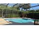 Screened-in pool and hot tub, surrounded by lush landscaping, creating a private backyard oasis at 433 Woodcrest St, Winter Springs, FL 32708