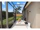 Screened-in patio shows organized pool equipment area and access to the backyard, enhancing functionality at 433 Woodcrest St, Winter Springs, FL 32708