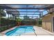 Private backyard featuring a sparkling pool and spa with screened enclosure, ideal for enjoying sunny days at 433 Woodcrest St, Winter Springs, FL 32708
