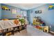 Blue bedroom filled with toys and books, complemented by truck-themed decor at 5660 Keaton Springs Dr, Lakeland, FL 33811