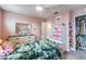 Cute bedroom with pink walls, closet, ceiling fan, and a dresser with drawers at 5660 Keaton Springs Dr, Lakeland, FL 33811