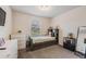 Cozy bedroom with neutral walls, carpet, window, and furnishings at 5660 Keaton Springs Dr, Lakeland, FL 33811