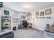 Well-lit bedroom with a workspace, decorated with collectibles and wall art at 5660 Keaton Springs Dr, Lakeland, FL 33811
