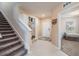Bright foyer with stairway, built-in storage, and access to another room at 5660 Keaton Springs Dr, Lakeland, FL 33811