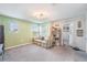 Cozy living room featuring a comfortable couch and shelving at 5660 Keaton Springs Dr, Lakeland, FL 33811