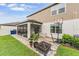 Covered patio with tiled flooring, outdoor seating, and a basketball hoop, great for entertaining and relaxation at 5660 Keaton Springs Dr, Lakeland, FL 33811