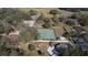 Aerial view of the property showcasing a tennis court and a basketball court at 6143 Black Walnut Dr, Bartow, FL 33830