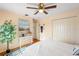 Inviting bedroom with a ceiling fan, hardwood floors, and double door closet at 6143 Black Walnut Dr, Bartow, FL 33830