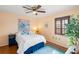 Charming bedroom with hardwood floors, a ceiling fan, and a bright window at 6143 Black Walnut Dr, Bartow, FL 33830