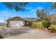 Charming single-story home featuring a two-car garage, landscaped yard, and well-maintained lawn at 6143 Black Walnut Dr, Bartow, FL 33830