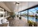 Enclosed patio with brick flooring, outdoor seating, and a view of the pool at 6143 Black Walnut Dr, Bartow, FL 33830