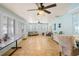 Spacious sunroom with tiled floors, ceiling fans, and plantation shutters at 6143 Black Walnut Dr, Bartow, FL 33830