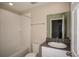 Bright bathroom featuring a shower-tub combination and a modern single sink vanity at 770 Ambleside Dr, Haines City, FL 33844
