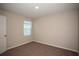 Carpeted bedroom with natural light from a window at 770 Ambleside Dr, Haines City, FL 33844