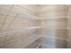 Walk-in closet with ample shelving for organized storage, maximizing space and convenience at 770 Ambleside Dr, Haines City, FL 33844