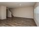 Bright, open living room with modern flooring and staircase at 770 Ambleside Dr, Haines City, FL 33844