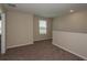 Upstairs loft featuring neutral carpet and a window with blinds at 770 Ambleside Dr, Haines City, FL 33844