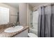 Bathroom featuring granite countertop and shower with a gray shower curtain at 1368 Axel Cir, Winter Haven, FL 33880