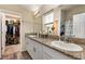 Bathroom features double sinks, granite countertops and a large walk in closet at 1368 Axel Cir, Winter Haven, FL 33880