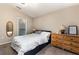 Comfortable bedroom with carpet, a view of the ensuite bathroom, and stylish furnishings at 1368 Axel Cir, Winter Haven, FL 33880