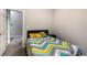 Bedroom featuring a colorful bedspread and neutral-toned carpet at 1368 Axel Cir, Winter Haven, FL 33880