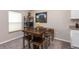 Dining area featuring wooden table with seating for four and modern decor at 1368 Axel Cir, Winter Haven, FL 33880