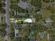 Aerial view shows the layout of the single Gathering home and the surrounding neighborhood at 306 Avenue A E, Winter Haven, FL 33880