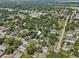Expansive aerial view of the home nestled in a lush, green neighborhood at 306 Avenue A E, Winter Haven, FL 33880