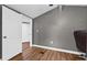 Well-lit bedroom offers hardwood floor and a view into the closet at 306 Avenue A E, Winter Haven, FL 33880