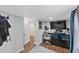 View of home's flex space that has closet space, a desk, television, and room to relax at 306 Avenue A E, Winter Haven, FL 33880