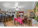 Dining area with wood paneling features a table and bar seating in a well-lit space at 306 Avenue A E, Winter Haven, FL 33880