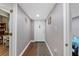 Entry hallway featuring hardwood floors and a view of the front door, leading into the home at 306 Avenue A E, Winter Haven, FL 33880