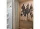 Shower space with grey-patterned curtain and wall art at 3759 King Hill Dr, Haines City, FL 33844