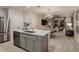 Open-concept kitchen and dining area with stainless steel appliances and stylish decor at 3759 King Hill Dr, Haines City, FL 33844