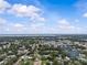 Aerial view of a suburban neighborhood with mature trees and lush landscaping on a sunny day at 4003 Prairie Bend Ln, Lakeland, FL 33812
