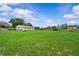 Expansive backyard with lush green grass, a fenced perimeter, and a single-story home at 4003 Prairie Bend Ln, Lakeland, FL 33812