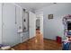 Bedroom with wood-look floors, small window, and an open doorway at 4003 Prairie Bend Ln, Lakeland, FL 33812