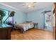 Light-blue bedroom with ceiling fan and a window at 4003 Prairie Bend Ln, Lakeland, FL 33812