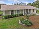 Charming single-story home with a well-manicured front yard and inviting front porch at 4003 Prairie Bend Ln, Lakeland, FL 33812