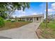 Charming home with inviting curb appeal, featuring a lush lawn and manicured landscaping at 4003 Prairie Bend Ln, Lakeland, FL 33812