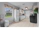 Bright kitchen with white cabinets, tile floors and a large window overlooking the yard at 4003 Prairie Bend Ln, Lakeland, FL 33812