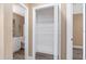 Hallway with linen closet and bathroom featuring granite vanity at 647 San Pedro Dr, Lady Lake, FL 32159