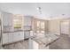 Updated kitchen with stainless steel appliances, granite countertops, subway tile backsplash, and bright lighting at 647 San Pedro Dr, Lady Lake, FL 32159