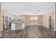 Open concept kitchen flowing into the living area, showcasing updated finishes and abundant natural light at 647 San Pedro Dr, Lady Lake, FL 32159