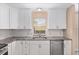 Well-lit kitchen with granite countertops, stainless steel appliances, and white cabinetry for a clean, modern look at 647 San Pedro Dr, Lady Lake, FL 32159